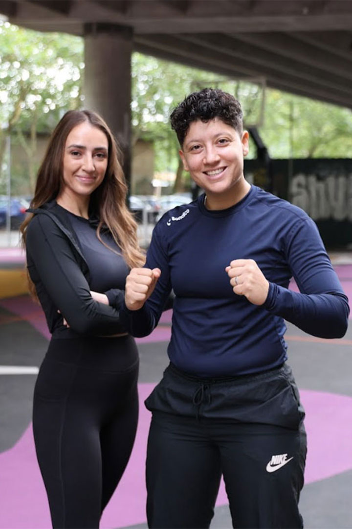 Coach Doaa and coach Yasmin smiling at the camera.